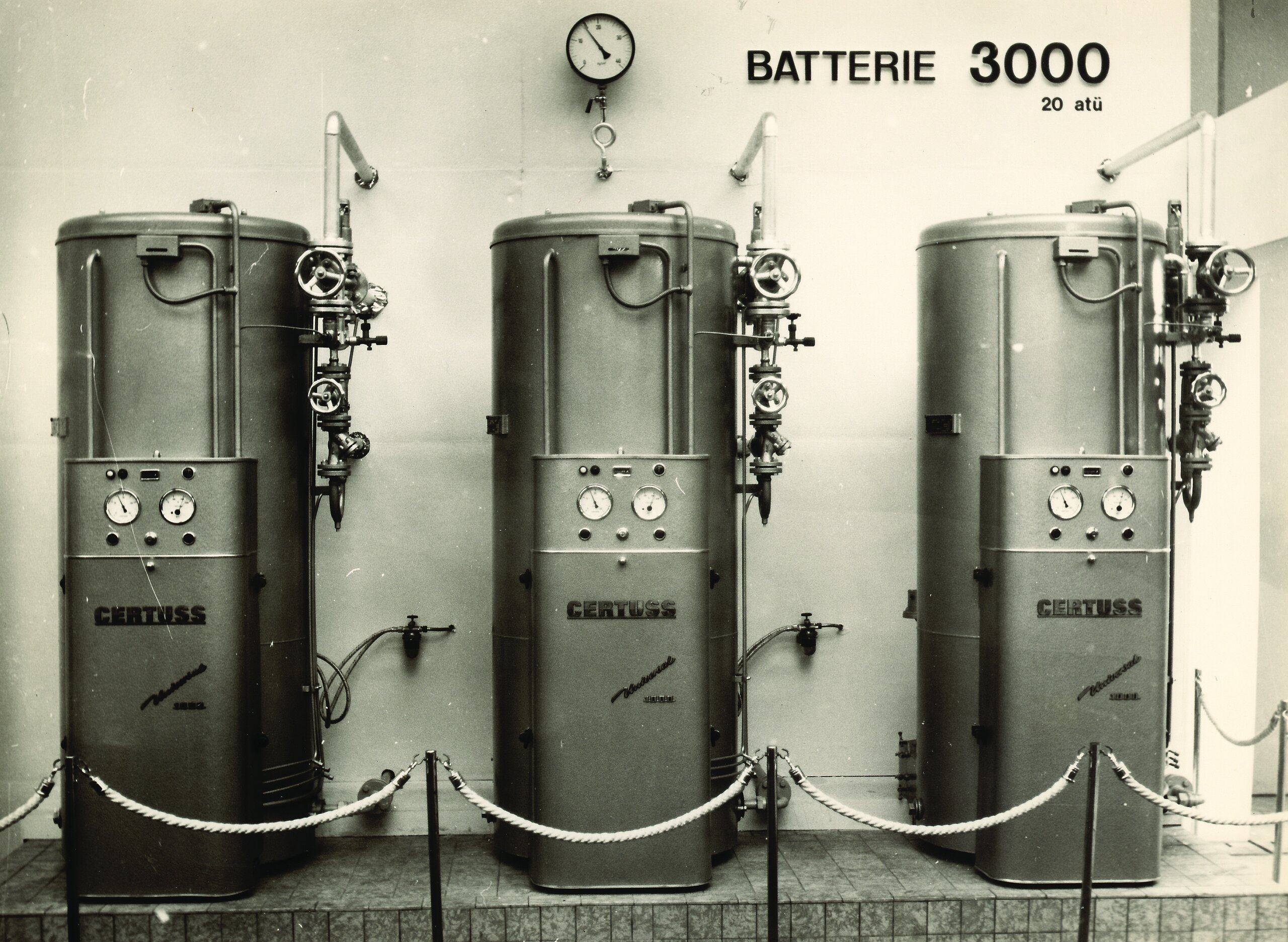 Black and white photo of 3 historic steam Boilers